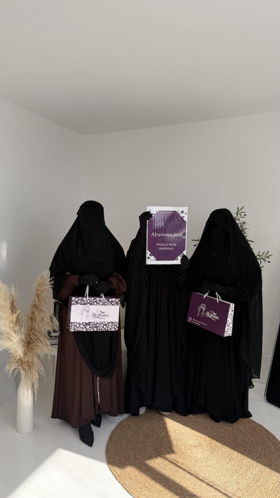 Three Alrawana khimars with niqab, photographed in the studio with Alrawana gift bags